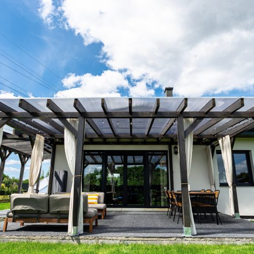 The,Terrace,Behind,The,House,Has,Visible,Beam,Connections,,The